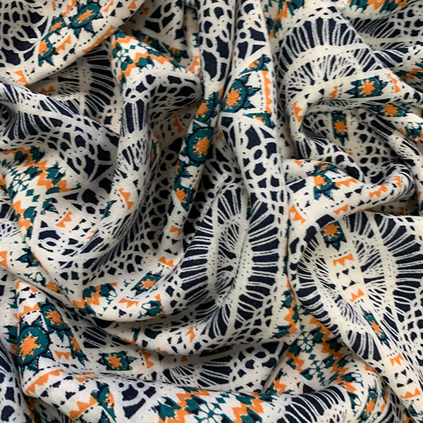 Orange and Green Lace Look Print Rayon Challis Fabric